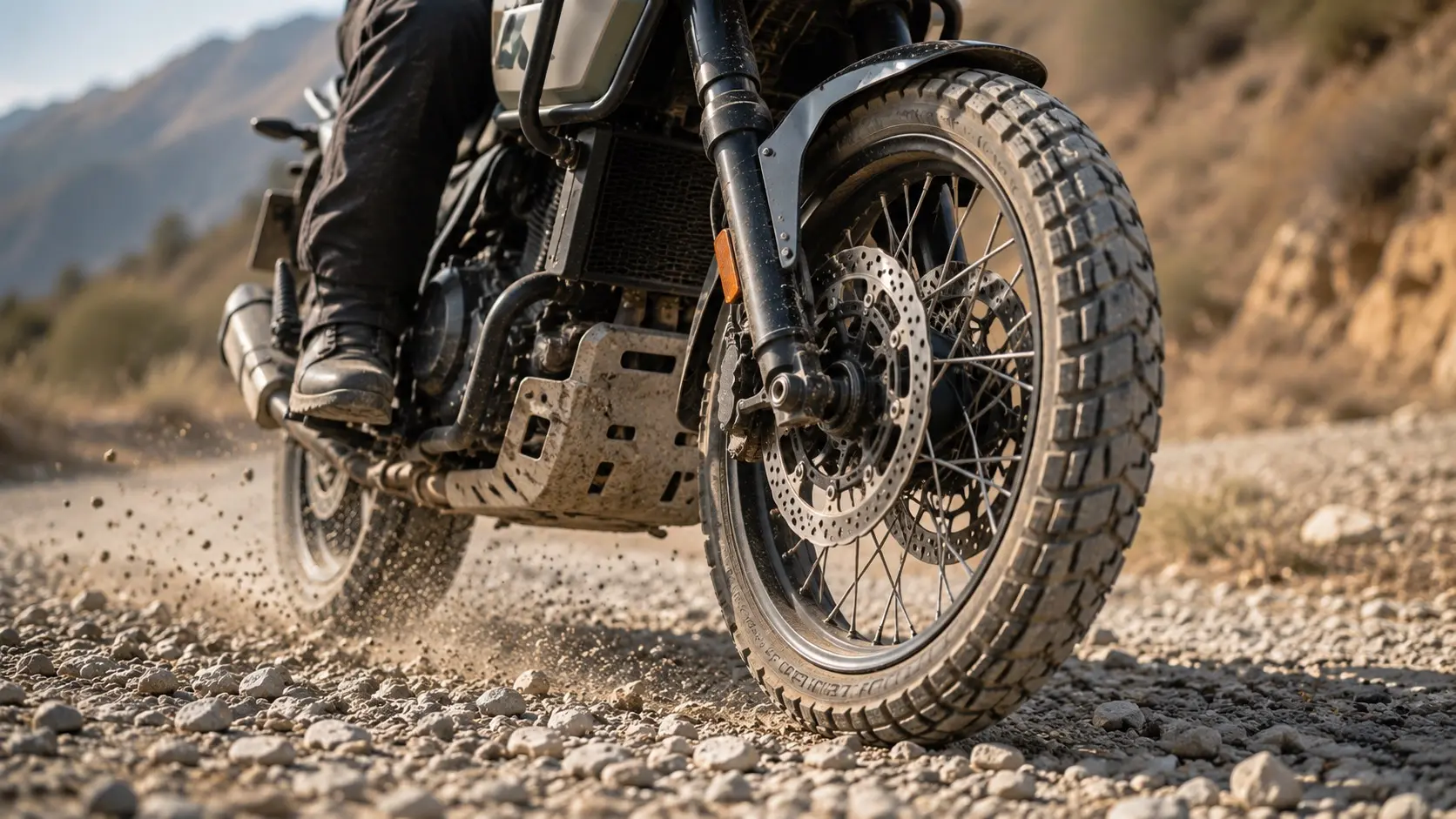 Motorcyclist riding steadily on loose gravel with relaxed posture