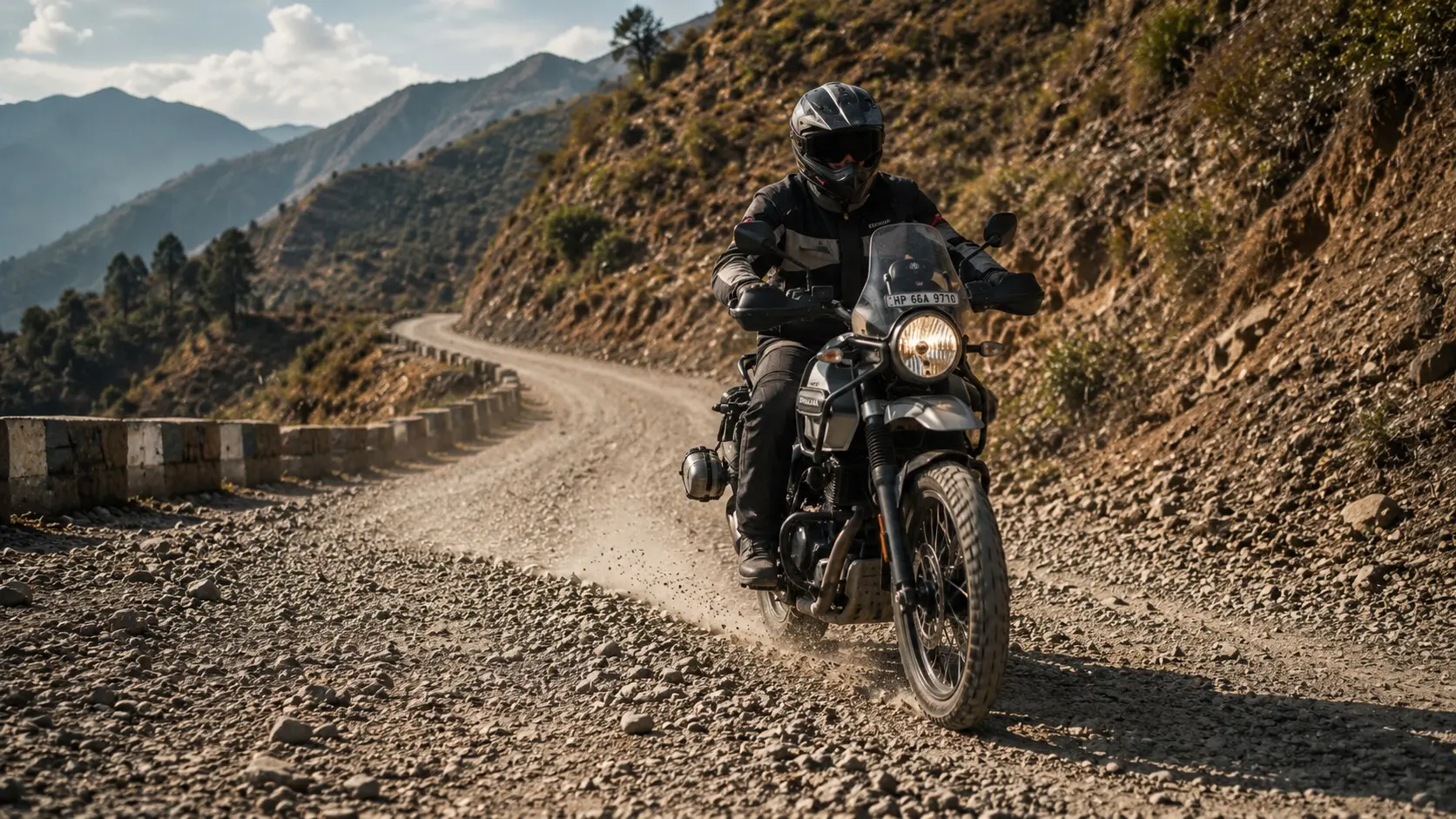Motorcyclist riding carefully on a gravel mountain road
